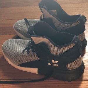 Black and white adidas sneakers.